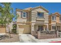 Inviting two-story house showcasing a cozy porch, attached garage, and tidy front yard at 10456 Prairie Schooner Ave, Las Vegas, NV 89129