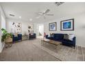 Bright living room with modern decor, plush seating, and stylish accents, creating a welcoming atmosphere at 10468 Concetta Ave, Las Vegas, NV 89129