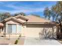 Charming home featuring a neutral stucco exterior and a two-car garage at 11076 Zampino St, Las Vegas, NV 89141