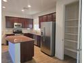 Spacious kitchen with an island, stainless steel appliances, and ample storage at 11298 Corsica Mist Ave, Las Vegas, NV 89135