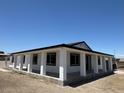 Rear view of single story house with a covered patio along the back, and a light-colored exterior at 1227 San Gabriel Ave, Henderson, NV 89002