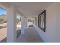 Covered walkway providing shade, with windows and columns adding visual interest at 1227 San Gabriel Ave, Henderson, NV 89002