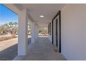Covered walkway showcasing columns and windows, adding architectural detail to the exterior at 1227 San Gabriel Ave, Henderson, NV 89002