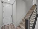 Welcoming entryway with a staircase and a modern front door at 12525 Lylan Ridge St, Las Vegas, NV 89138