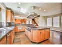 Spacious kitchen with a large island, stainless steel appliances, and tile flooring at 1737 Cypress Manor Dr, Henderson, NV 89012
