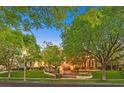 Well-manicured front yard with mature trees and manicured landscaping at 1809 White Hawk Ct, Las Vegas, NV 89134