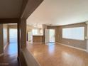 Spacious living room area featuring hardwood floors, natural light, neutral paint, and an open floor plan at 1881 W Alexander Rd # 2129, North Las Vegas, NV 89032
