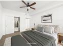 Bright bedroom featuring a ceiling fan, closet, and neutral decor at 231 W Horizon Ridge Pkwy # 212, Henderson, NV 89012