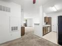 Open-concept kitchen with stainless steel appliances, modern cabinetry, and view to the living space at 231 W Horizon Ridge Pkwy # 212, Henderson, NV 89012