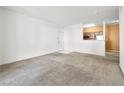Inviting open concept living space with adjacent kitchen, neutral tones, and ample room for furnishings at 231 W Horizon Ridge Pkwy # 212, Henderson, NV 89012
