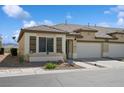 Inviting single-story home showcasing well-maintained landscaping and a cozy front facade at 2453 Vivid Sky Pl, Henderson, NV 89044