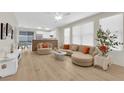 Spacious living room featuring contemporary furnishings, ample natural light, and an open floor plan at 2633 Spider Cactus Ct, Las Vegas, NV 89106