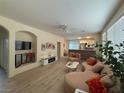 Bright living room with hardwood floors and stylish decor seamlessly flowing into the kitchen at 2633 Spider Cactus Ct, Las Vegas, NV 89106