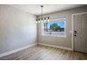 Bright dining room with new hardwood floors and modern lighting at 280 Gentry St, Overton, NV 89040