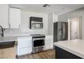 Modern kitchen features stainless steel appliances and white cabinets at 280 Gentry St, Overton, NV 89040
