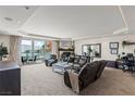Bright living room featuring plush seating, fireplace, balcony, and neutral tones at 2857 Paradise Rd # 401, Las Vegas, NV 89109