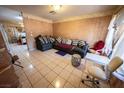 Living room features tile flooring, neutral paint, couches, and natural light at 2906 Cedar Ave, Las Vegas, NV 89101
