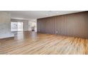 Large living room with wood floors and modern wall accents at 3386 El Camino Real, Las Vegas, NV 89121