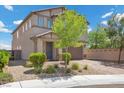 Inviting two story home featuring a well maintained lawn and neutral colored facade at 4030 Midnight Crest Ave, North Las Vegas, NV 89031
