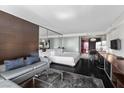 Stylish bedroom includes a sitting area, sleek decor, and integrated kitchenette at 4381 W Flamingo Rd # 3809, Las Vegas, NV 89103