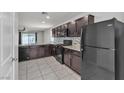 Well-equipped kitchen features dark cabinets, granite countertops, and stainless steel appliances at 4544 Velvet Oak Ct, Las Vegas, NV 89115