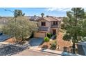 Beautiful two-story house featuring a well-maintained yard and a two car garage in a quiet neighborhood at 4562 Sparwood Dr, Las Vegas, NV 89147