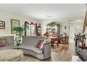Cozy living room with hardwood floors and elegant furniture, perfect for relaxing and entertaining at 5507 Gemini Bridges St, Las Vegas, NV 89130