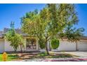 Charming single story home with desert landscaping, an attached garage, and a front gate at 5713 Whiteridge Ave, Las Vegas, NV 89107