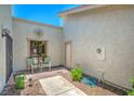 Cozy outdoor patio area with seating and mature landscaping at 5713 Whiteridge Ave, Las Vegas, NV 89107