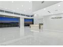 Bright, open living room with expansive windows showcasing panoramic city views and modern finishes at 641 Majestic Rim Dr, Henderson, NV 89012