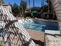 Community pool with lounge chairs and covered area, perfect for relaxation at 75 N Valle Verde Dr # 411, Henderson, NV 89074