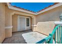 Close-up of the front porch and entrance, featuring a secure gate and tiled flooring at 7824 Faith Ct, Las Vegas, NV 89131