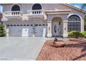 Beautiful home featuring a three-car garage, classic balconies, and inviting front entrance at 8224 Fawn Meadow Ave, Las Vegas, NV 89149