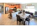 Eat-in kitchen features a breakfast bar, stainless steel appliances, and lots of cabinet space at 8305 Minots Ledge Ave, Las Vegas, NV 89147