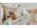 Spacious living area blending seamlessly with an open kitchen and staircase at 1101 Elation Ln # 2, Henderson, NV 89002