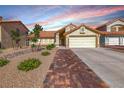 Charming single-story home with a well-maintained front yard and two-car garage at 234 Geronimo Ct, Henderson, NV 89074