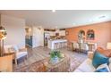 Open floor plan with a seamless transition from living to dining to the stylish kitchen at 2510 Petunia Garden St # 227, North Las Vegas, NV 89081