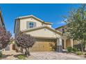 Charming two-story home featuring a brick driveway, a spacious two-car garage, and inviting landscaping at 2806 Calle Cadiz, Henderson, NV 89044