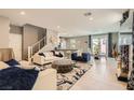 Bright living room features stylish furniture, chic decor, and plenty of space to relax and entertain at 2806 Calle Cadiz, Henderson, NV 89044