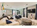 Bright living room features stylish furniture, chic decor, and plenty of space to relax and entertain at 2806 Calle Cadiz, Henderson, NV 89044