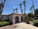 Inviting single-story home with well-maintained landscaping and a charming arched entrance at 4555 E Sahara Ave # 122, Las Vegas, NV 89104