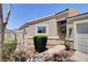 Inviting single-story home with a desert landscape and manicured front yard at 5043 Mascaro Dr, Las Vegas, NV 89122