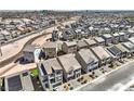Wide aerial shot showcases a thriving community with many homes in neat rows and desert landscaping at 5904 Becklow Gardens Ave, Las Vegas, NV 89141