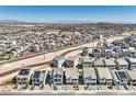 Expansive aerial view of a well-planned community with modern homes and scenic mountain views at 5904 Becklow Gardens Ave, Las Vegas, NV 89141