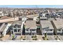 Beautiful aerial view of homes in a vibrant community, some featuring solar panels and private pools at 5904 Becklow Gardens Ave, Las Vegas, NV 89141