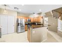 Well-lit kitchen with stainless steel appliances and granite countertops, perfect for cooking at 6050 Golden Corral Trl # 102, Henderson, NV 89011
