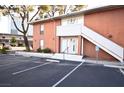 Two-story brick apartment building featuring designated parking and staircase access to the second floor entrance at 634 Oakmont Ave # 1903, Las Vegas, NV 89109