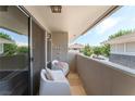Relaxing outdoor balcony with stylish seating, offering a peaceful space at 753 Oakmont Ave # 802, Las Vegas, NV 89109