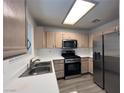 Bright kitchen featuring stainless steel appliances, ample counter space, and modern cabinetry at 8017 Cherish Ave, Las Vegas, NV 89128