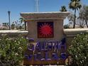 Entrance sign for Galleria Villas with flowers and manicured plants at 855 N Stephanie St # 2311, Henderson, NV 89014